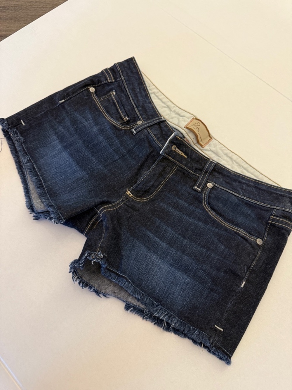 PAIGE Dark Indigo Frayed Hem Jean Shorts - Picture 3 of 9